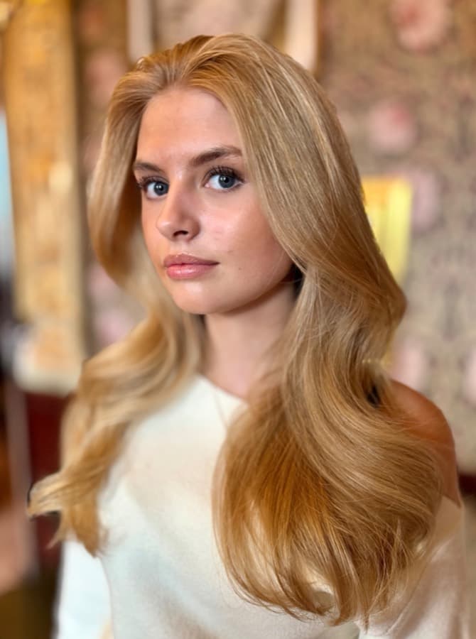 Warm copper blonde with glossy, dimensional tone through the lengths